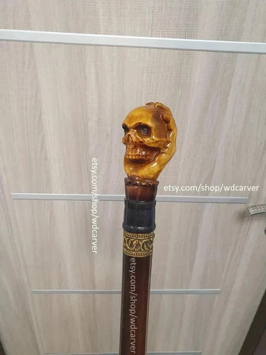 Skull handle hand - , carved