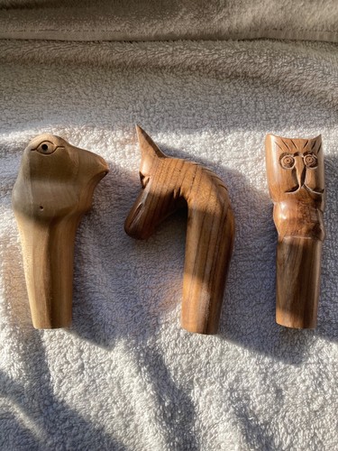 Three hand carved wood - three,
